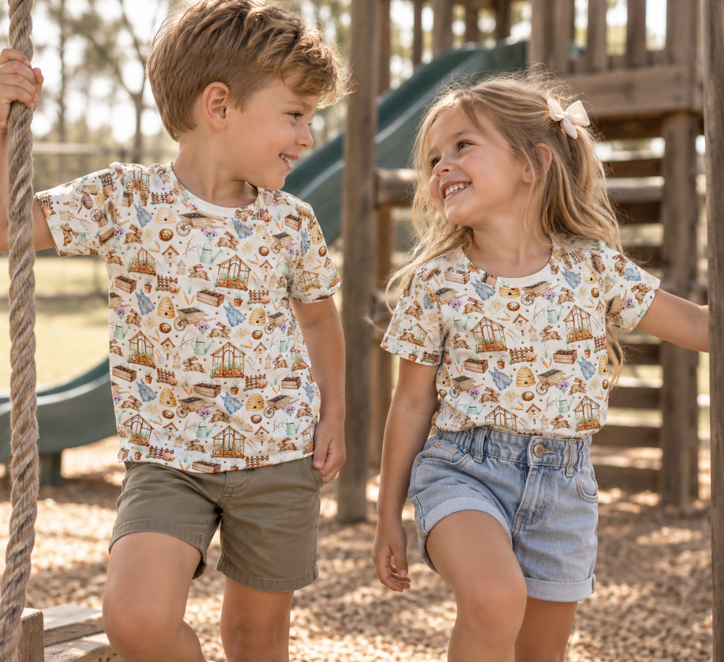 Boy and girl wearing Little Acres Co garden print organic cotton kids shirts