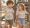 Boy and girl wearing Little Acres Co garden print organic cotton kids shirts