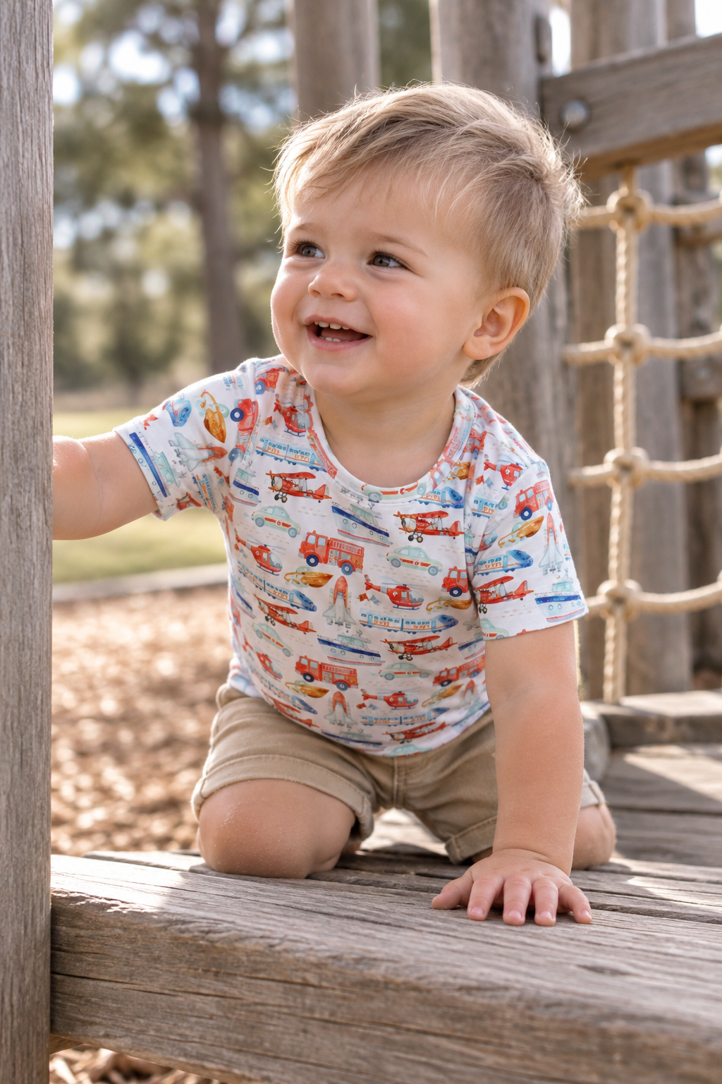 boy wearing Little Acres Co transport print organic cotton t-shirt